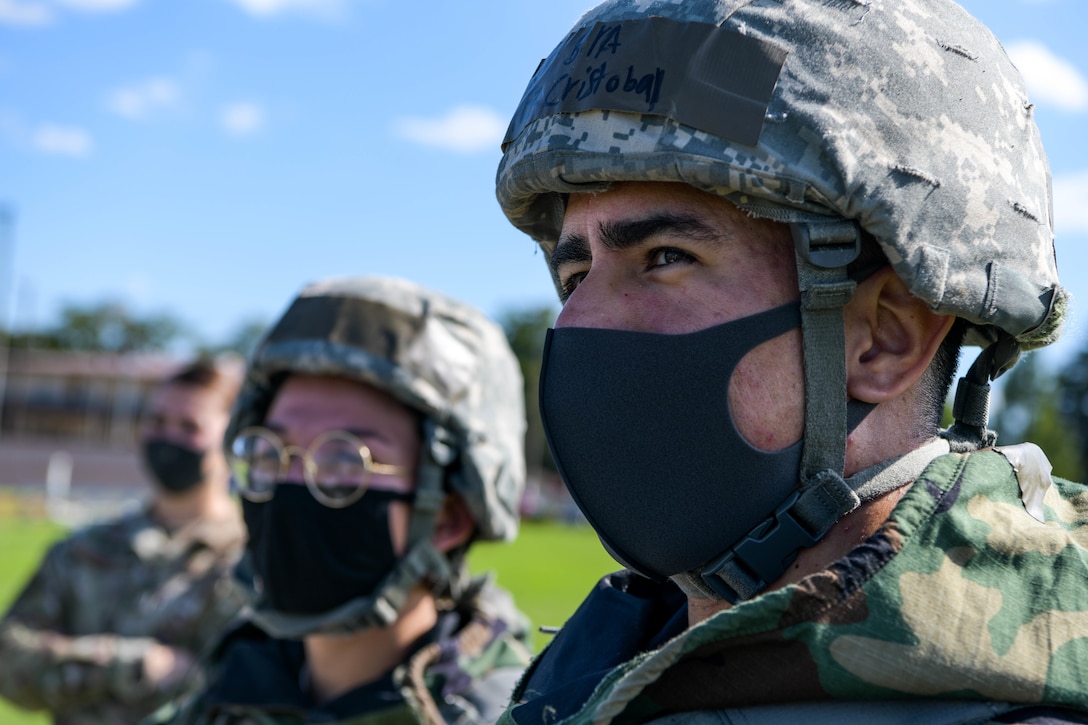 Senior Airman Cristobal Lopez, 374th Force Support listens to instruction during a decontamination brief at the squadron's war fighting training day.