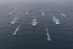 NORTH SEA (Oct. 4, 2020) The full United Kingdom (UK) Carrier Strike Group (CSG) sails in formation for a photo exercise (PHOTOEX). The CSG  is led by the Royal Navy aircraft carrier HMS Queen Elizabeth (R 08) and includes flotilla of destroyers and frigates from the UK, the Netherlands, the U.S. Navy guided-missile destroyer USS The Sullivans (DDG 68), and 15 F-35B Lightning II's from Marine Fighter Attack Squadron 211 and the UK's 617 Squadron. (U.S. Navy photo courtesy of the Royal Navy)