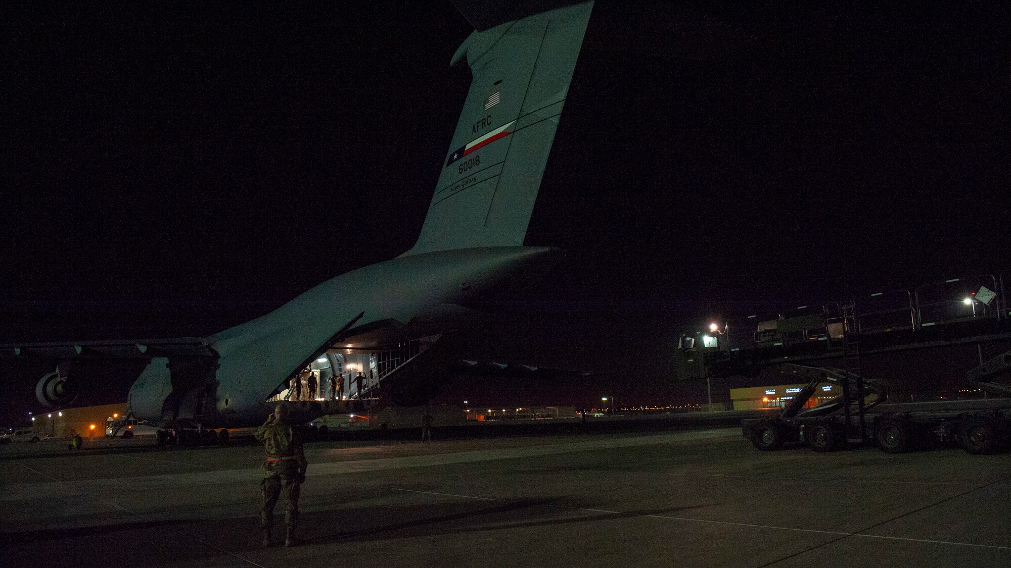 A C-5 Galaxy sits on the flight line of Al Udeid Air Base, Qatar, Sept. 25, 2020, to deliver a specialized medical container designed to transport individuals with infectious diseases. The Negatively Pressurized Conex-Lite is a smaller variation of the Negatively Pressurized Conex and is configured to safely transport up to nine patients, including ambulatory and litter, around the globe.