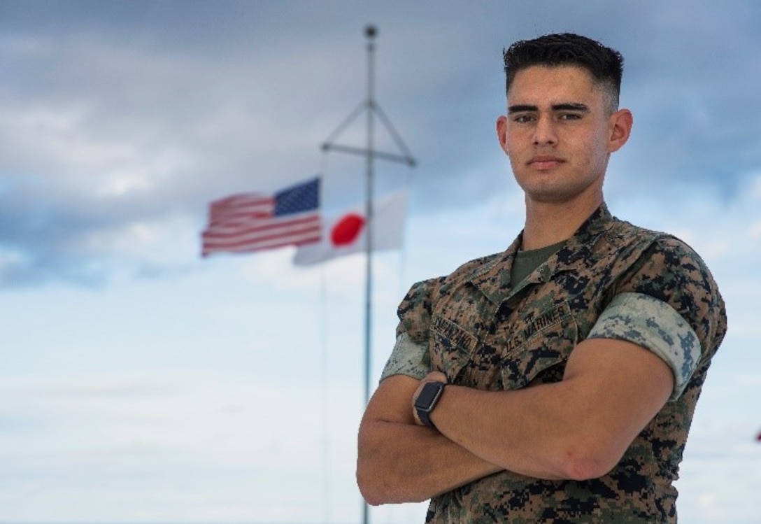 U.S. Marine Corps Lance Cpl. Juan Carpanzano, a combat photographer with 3rd Marine Division, poses for a photo at Camp Courtney, Okinawa, Japan, Sept. 17, 2020.(U.S. Marine Corps photo by Cpl. Hannah Hall)