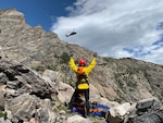 A Colorado Army National Guard UH-60 Black Hawk helicopter from the Army Aviation Support Facility, Buckley Air Force Base, Aurora, Colorado, approaches a member of the Alpine Rescue Team and an injured climber in Rocky Mountain National Park Aug. 30, 2019. The Colorado Hoist Rescue Team provides hoist extraction capability throughout Colorado by incorporating civilian alpine rescue personnel and military helicopter capabilities.