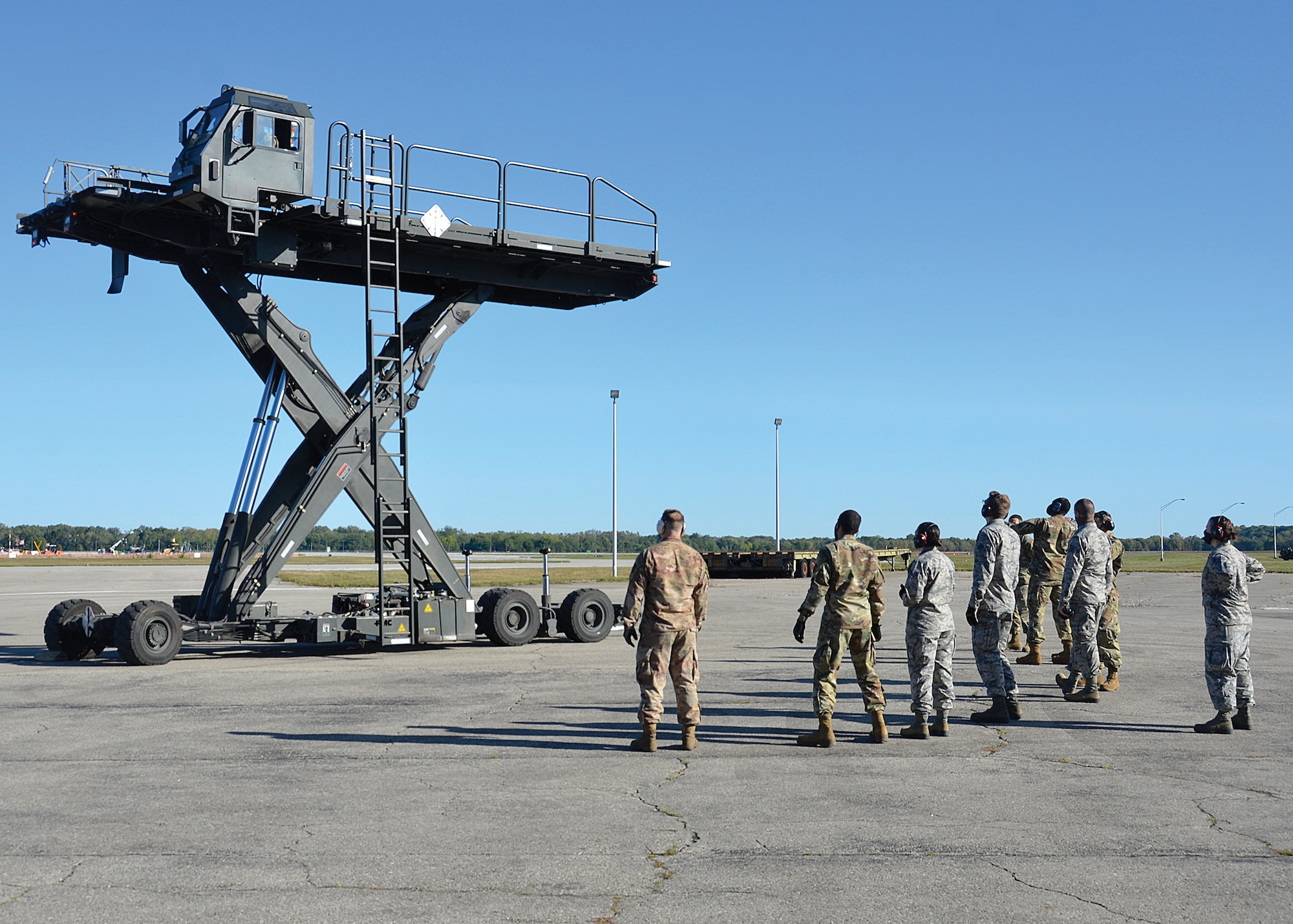Airmen from the 87th Aerial Port Squadron practice the operation of a Halvorsen Loader Sept. 19, 2020, at Wright-Patterson Air Force Base, Ohio. The Halvorsen Loader, which entered into service in 2001, is a rapidly deployable, high reach mechanized aircraft loader that can transport and lift up to 25,000 of cargo 18 feet into the air to be loaded onto civilian and military aircraft.