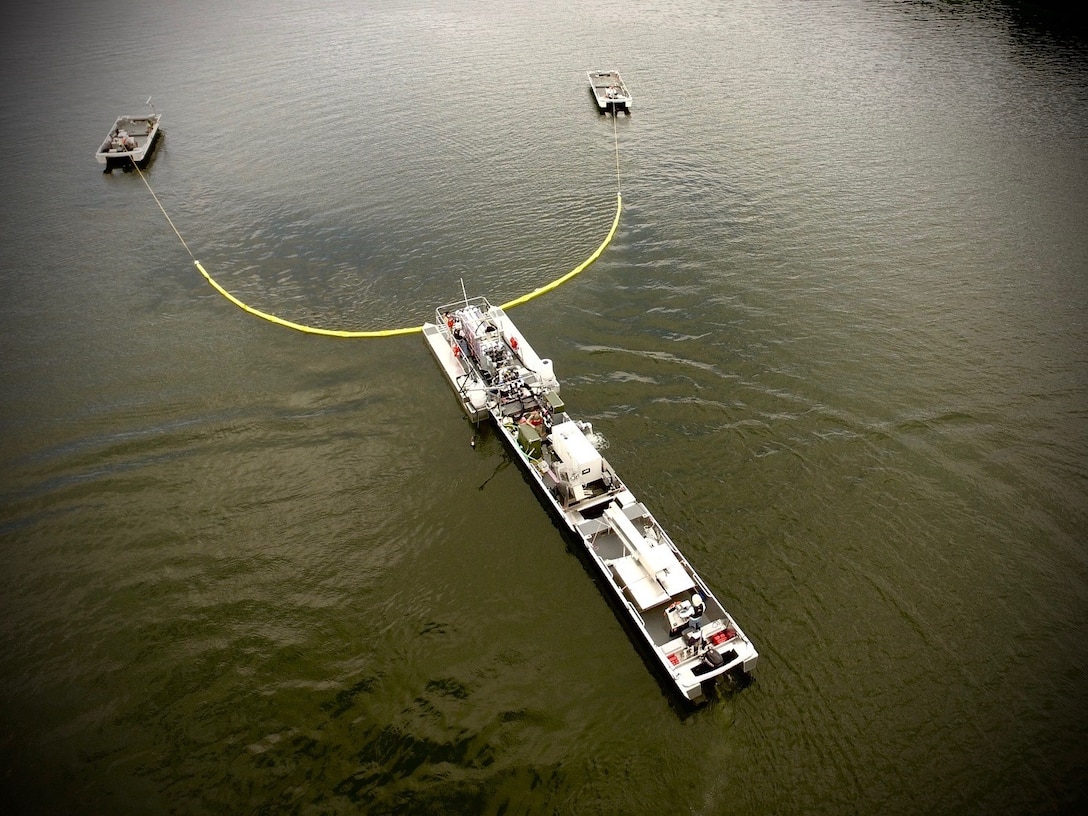 Aerial view of U.S. Army Engineer Research and Development Center (ERDC) researchers as they perform preliminary flow and operations studies on a new system for algae interception and treatment on Chautauqua Lake, N.Y. The ERDC researchers worked with Elastec, Inc. to build the initial prototype this summer. ERDC collaborated with New York State Department of Environmental Conservation (NYSDEC) scientists and industry partners to study harmful algal bloom mitigation technology in Chautauqua Lake from Aug. 19 through Sept. 4.