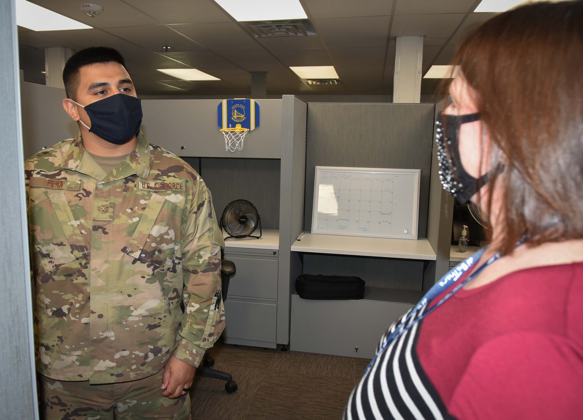 Mary Arnold, 301st Fighter Wing director of psychological health, speaks with U.S. Air Force Staff Sgt. Jose Pena, 301 FW Force Support Squadron career development technician during her visit to the 301 FW Force Support Squadron at U.S. Naval Air Station Joint Reserve Base Fort Worth, Texas on October 3, 2020. Arnold uses this opportunity to let Airmen know her office is available to help them navigate life stresses. (U.S. Air Force photo by Senior Airman William Downs)