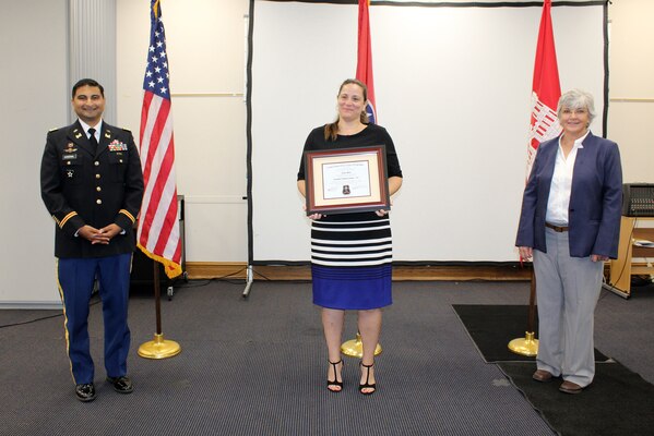 Sondra Abanto (Center), U.S. Army Corps of Engineers Nashville District, receives a certificate of completion for the 2020 Leadership Development Program Level I Course from Lt. Col. Sonny B. Avichal, Nashville District commander, and Patricia Coffey, deputy district engineer, during a graduation ceremony Sept. 10, 2020 at the Scarritt Bennett Center in Nashville, Tennessee. The district recently named Abanto the employee of the month for August 2020. (USACE photo by Mark Rankin)