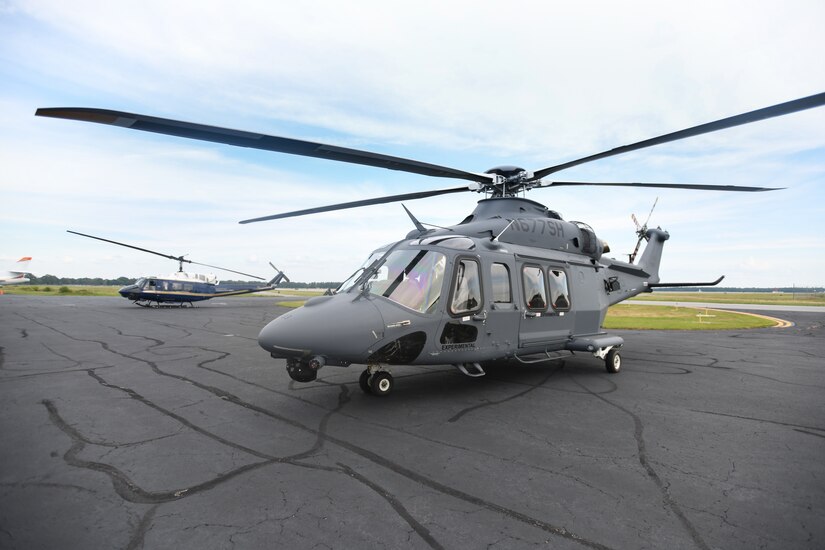 A UH-1N Huey (left) and an MH-139A Grey Wolf (right) sit side-by-side at an airfield in Richmond, Va., July 30, 2020.