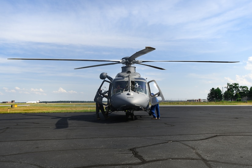 Pilots from the 1st Helicopter Squadron and the 413th Flight Test Squadron inspect an MH-139A Grey Wolf at an airfield in Richmond, Va., July 30, 2020.