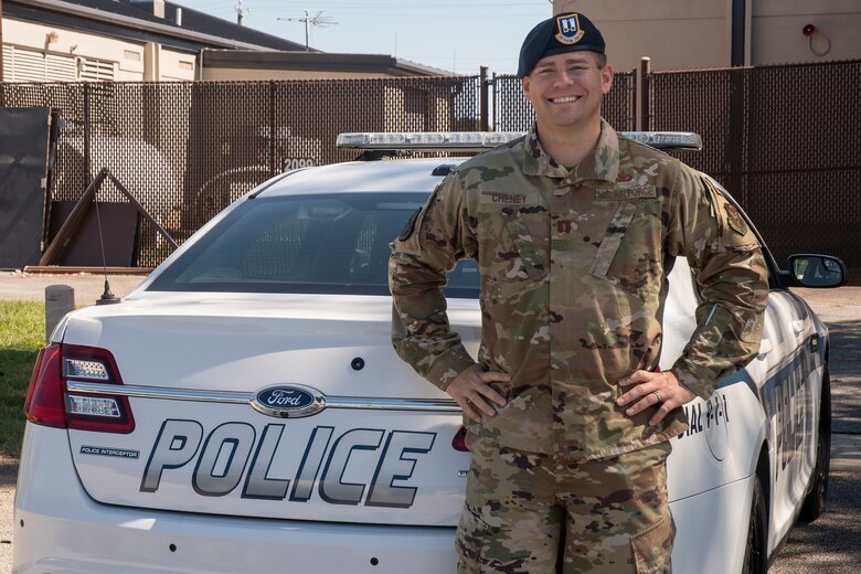 Capt. Ryan Cheney, 94th Security Forces Squadron operations officer, poses for a photo next to a patrol car at Dobbins Air Reserve Base, Ga., Oct. 2, 2020. Cheney was awarded the Sijan award this year in recognition of his exceptional leadership skills, which include managing a squadron of more than 50 security forces Airmen to protect nearly 6,000 base personnel. (U.S. Air Force photo/Andrew Park)