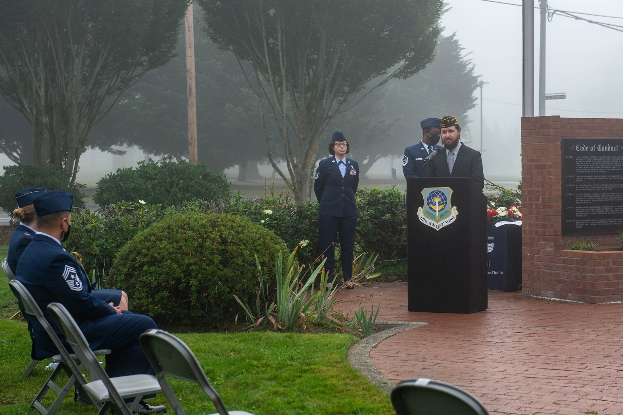 Retired Sgt. 1st Class Jason Paxton, vice president of Veterans of Foreign War Post 2329, speaks at a podium during a wreath laying ceremony honoring prisoners of war (POW) and service members missing in action (MIA)