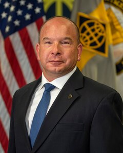 Barry Hoffman, U.S. Army Financial Management Command deputy to the commanding general, poses for his official photo at the Maj. Gen. Emmett J. Bean Federal Center in Indianapolis Sept. 21, 2020. USAFMCOM conducts enterprise-level financial operations and provides technical coordination for Finance and Comptroller units and military pay support with commands across the Army in order to ensure the effective implementation of policies and programs to support optimally resourcing the Army and supporting Soldiers. (U.S. Army photo by Mark R. W. Orders-Woempner)