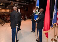 Col. Elliott R. Caggins, Brig. Gen. Vincent F. Malone II, Col. Scott J. Madore and MSgt. Willie D. Richardson (l-r) prepare to pass the Acquisition flag during Project Manager Soldier Lethality’s July 10 Change of Charter Ceremony at Picatinny Arsenal, N.J.  Col. Malone replaced Col. Caggins who retired from the Army after 30 years of service.