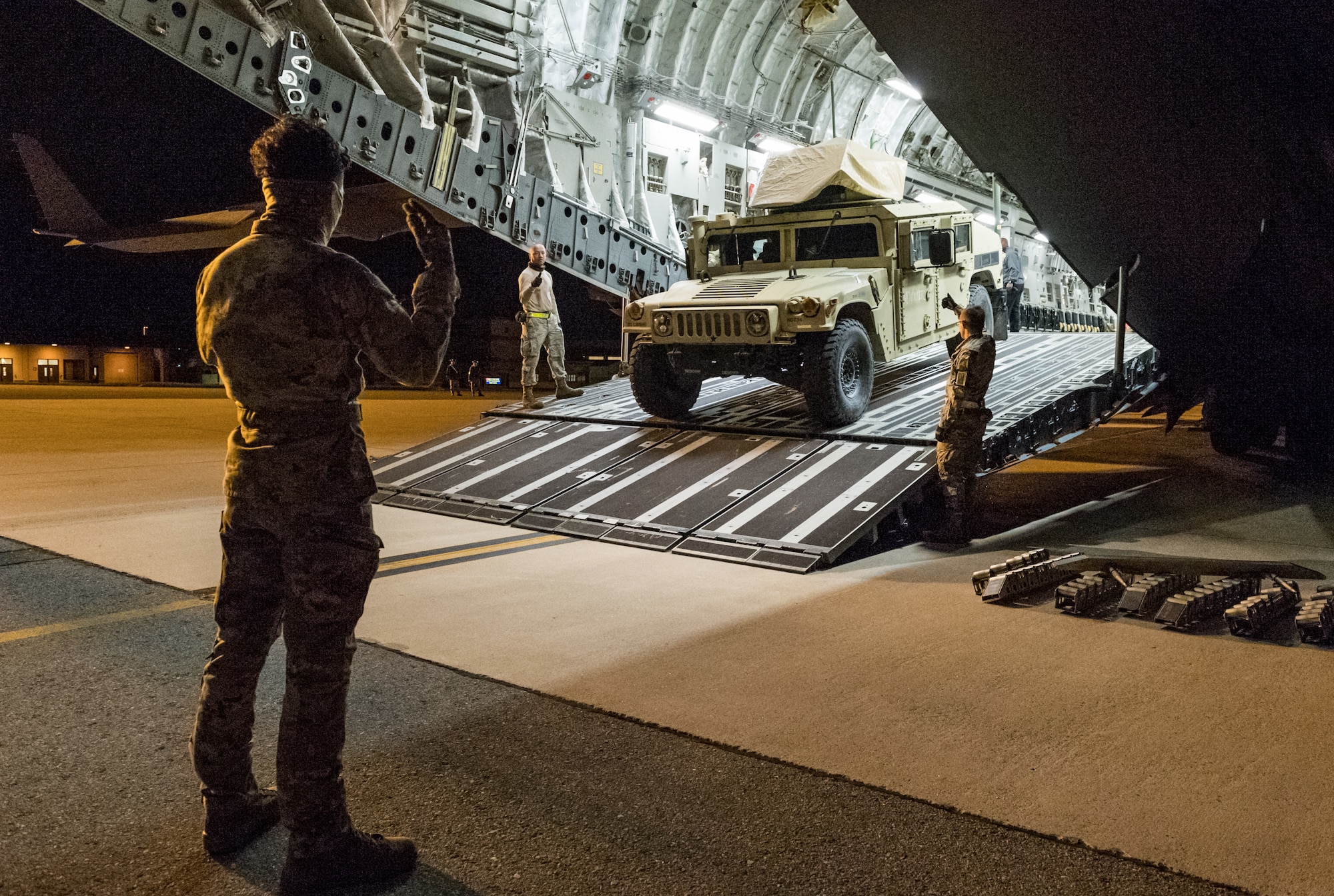 Ramp operations personnel assigned to the 436th Aerial Port Squadron off-load a Humvee belonging to the U.S. Army’s 20th Chemical, Biological, Radiological, Nuclear and Explosives Command Sept. 19, 2020, at Dover Air Force Base, Delaware. The 20th CBRNE Command recently conducted a deployment readiness exercise, which consisted of several inspections, aerial troop movements and convoys. The 20th CBRNE Command ensures the effective countering of CBRNE hazards at home and abroad. Dover AFB serves as the primary port of embark for the 20th CBRNE Command during both exercises and operations and regularly supports similar joint missions. (U.S. Air Force photo by Roland Balik)