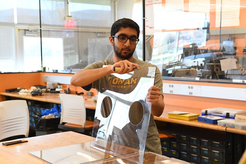 Kunj Parmar, son of Shailesh Parmar and former PM SL summer engineering intern, smooths the side panel edge of one of the intubation boxes he and his Rowan University roommates fabricated to help protect the state’s health care workers. The students and their professor were recognized publicly in April by N.J. Governor Phil Murphy for helping to protect the state’s health care workers.