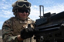 A U.S. Marine with Alpha Battery, 1st Battalion, 12th Marine Regiment, fires a MK-19 grenade launcher during a training event aboard Pohakuloa Training Area, Hawaii, Sept. 19, 2020. Marines with 1/12 conducted the training as part of Spartan Fury, a training exercise that aims to strengthen the artillery unit’s expeditionary readiness and tactical proficiency. (U.S. Marine Corps photo by Sgt. Luke Kuennen)