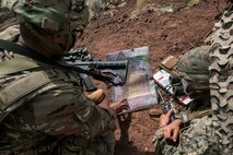 U.S. Marines with 1st Battalion, 12th Marine Regiment and U.S. Army Soldiers with 3rd Battalion, 7th Field Artillery Regiment, occupy Observation Point Ahi, Pohakuloa Training Area, Hawaii, Sept. 19, 2020. Marines and soldiers conducted forward artillery observation as part of Exercise Spartan Fury, a joint effort led by 1/12 that stresses service cohesion, expeditionary readiness, and a free exchange of knowledge and skills between the two artillery units. (U.S. Marine Corps photo by Sgt. Luke Kuennen)