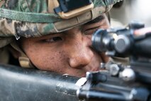 A U.S. Marine with Charlie Battery, 1st Battalion, 12th Marine Regiment, sights in his target pointer and illuminator prior to a low light live fire training event aboard Pohakuloa Training Area, Hawaii, Sept. 20, 2020. Marines with 1/12 conducted the training as part of Spartan Fury, a training exercise that aims to strengthen the artillery unit’s expeditionary readiness and tactical proficiency. (U.S. Marine Corps photo by Sgt. Luke Kuennen)