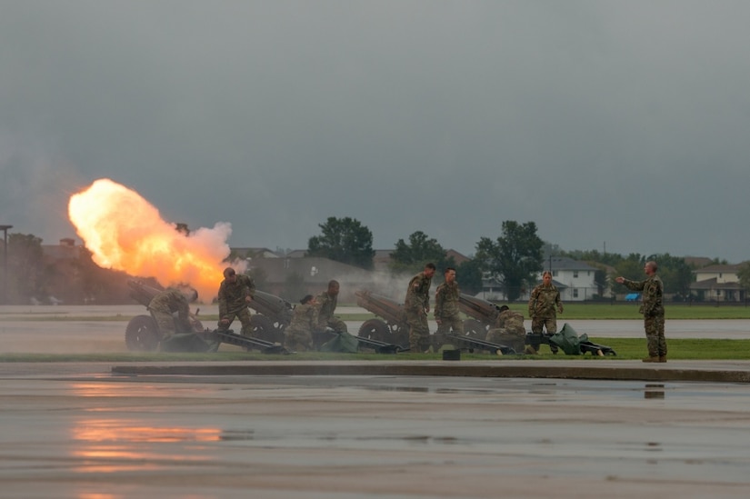 Soldiers fire a 17-volley salute.