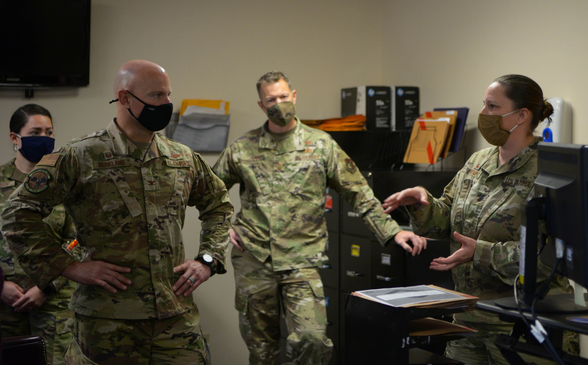 U.S. Air Force Col. David Berkland, left, the 354th Fighter Wing  commander, and Chief Master Sgt. John Lokken, center, the 354th FW command chief, speak with Lt. Col. Heather Wempe, the 354th Force Support Squadron commander during a wing leadership immersion on Eielson Air Force Base, Alaska, Oct. 6, 2020. Berkland visited the force support squadron to personally connect with Airmen and see how their roles contribute to Eielson’s overall mission. (U.S. Air Force photo by Senior Airman Beaux Hebert)