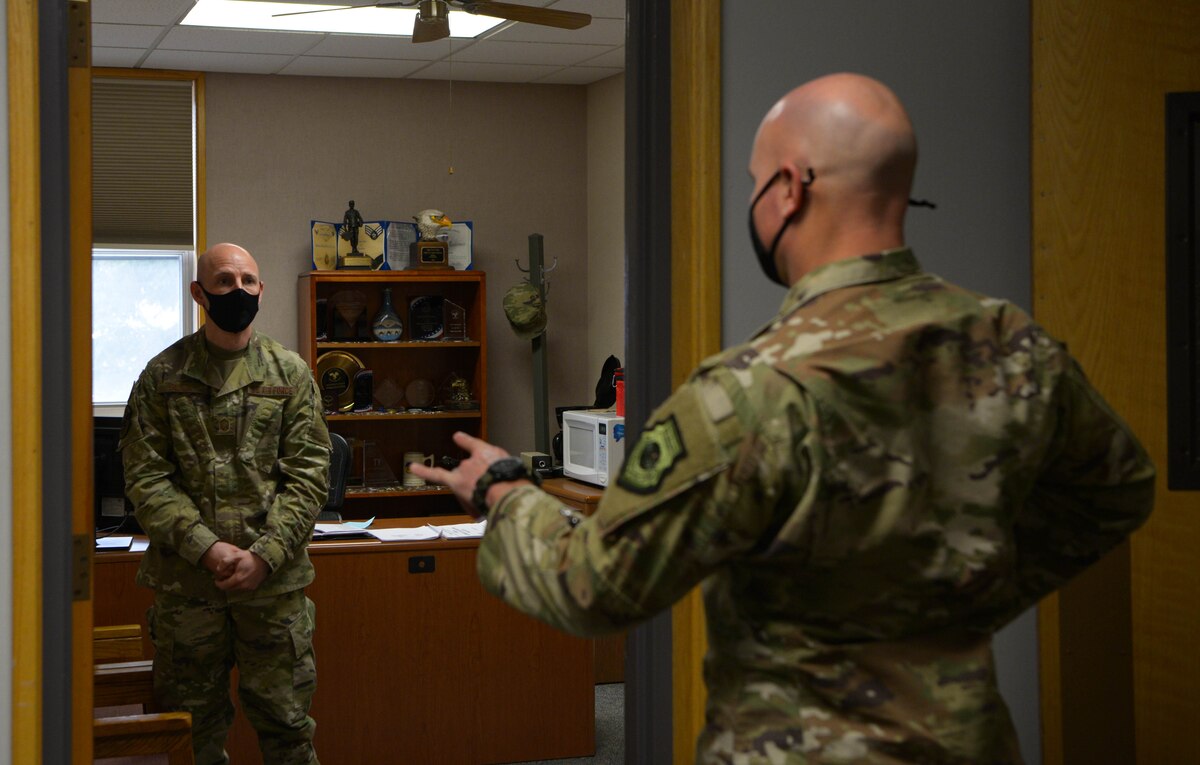 U.S. Air Force Col. David Berkland, left, the 354th Fighter Wing commander, speaks with Senior Master Sgt. Travis Glick, the 354th Force Support Squadron manpower and organization superintendent, during a wing leadership immersion on Eielson Air Force Base, Alaska, Oct. 6, 2020. The manpower section is responsible for providing Air Force leaders the analysis and tools to identify manpower requirements for the most effective and efficient accomplishment of Air Force missions. (U.S. Air Force photo by Senior Airman Beaux Hebert)