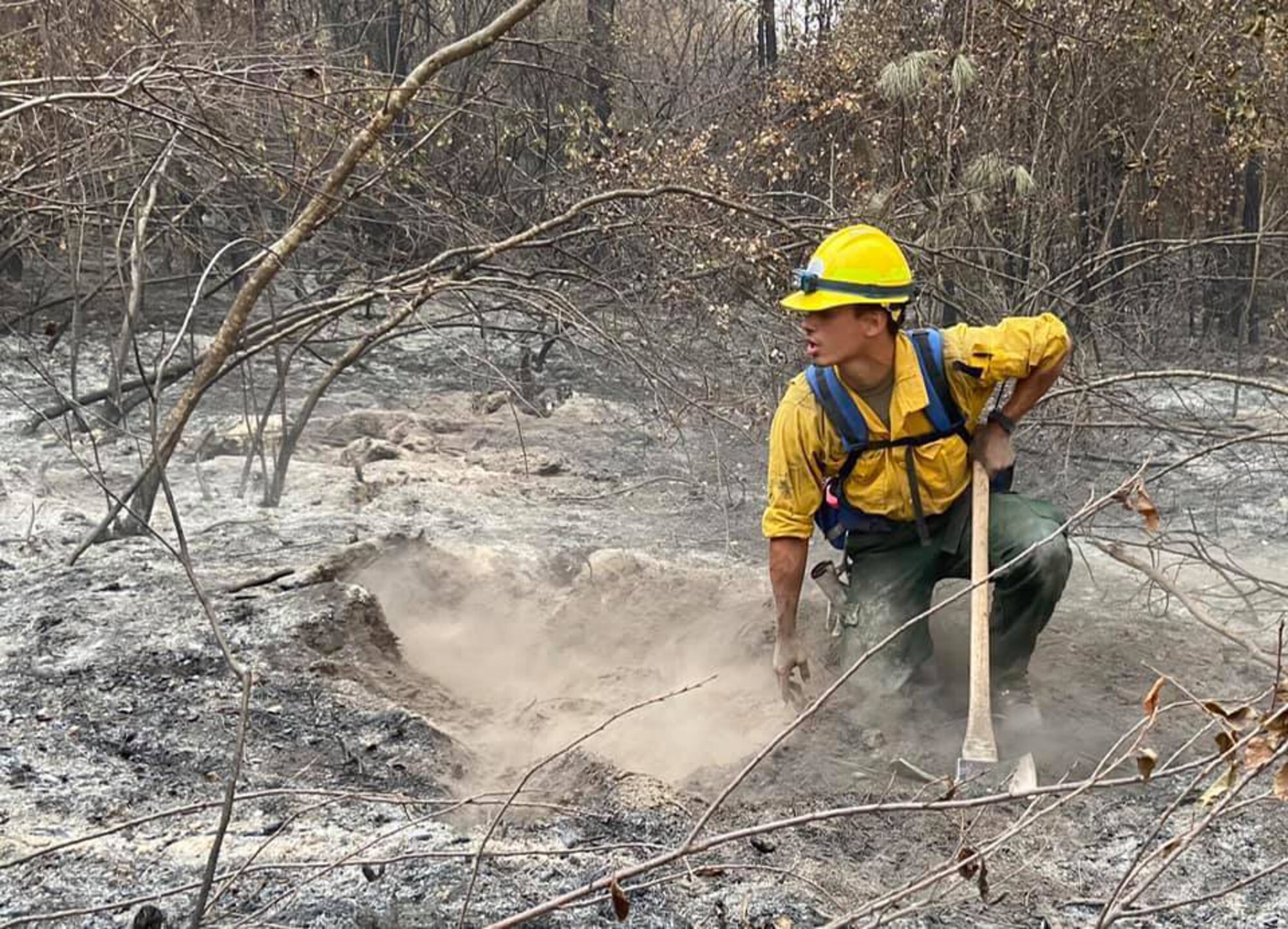 Senior Airman Payton Chiou, 225th Support Squadron, Western Air Defense Sector, helps the Washington State Department of Natural Resources fight wildfires near Inchelium, Washington, Sept. 16, 2020. The 15-person Air National Guard crew spent more than 10 days fighting fires in eastern Washington.