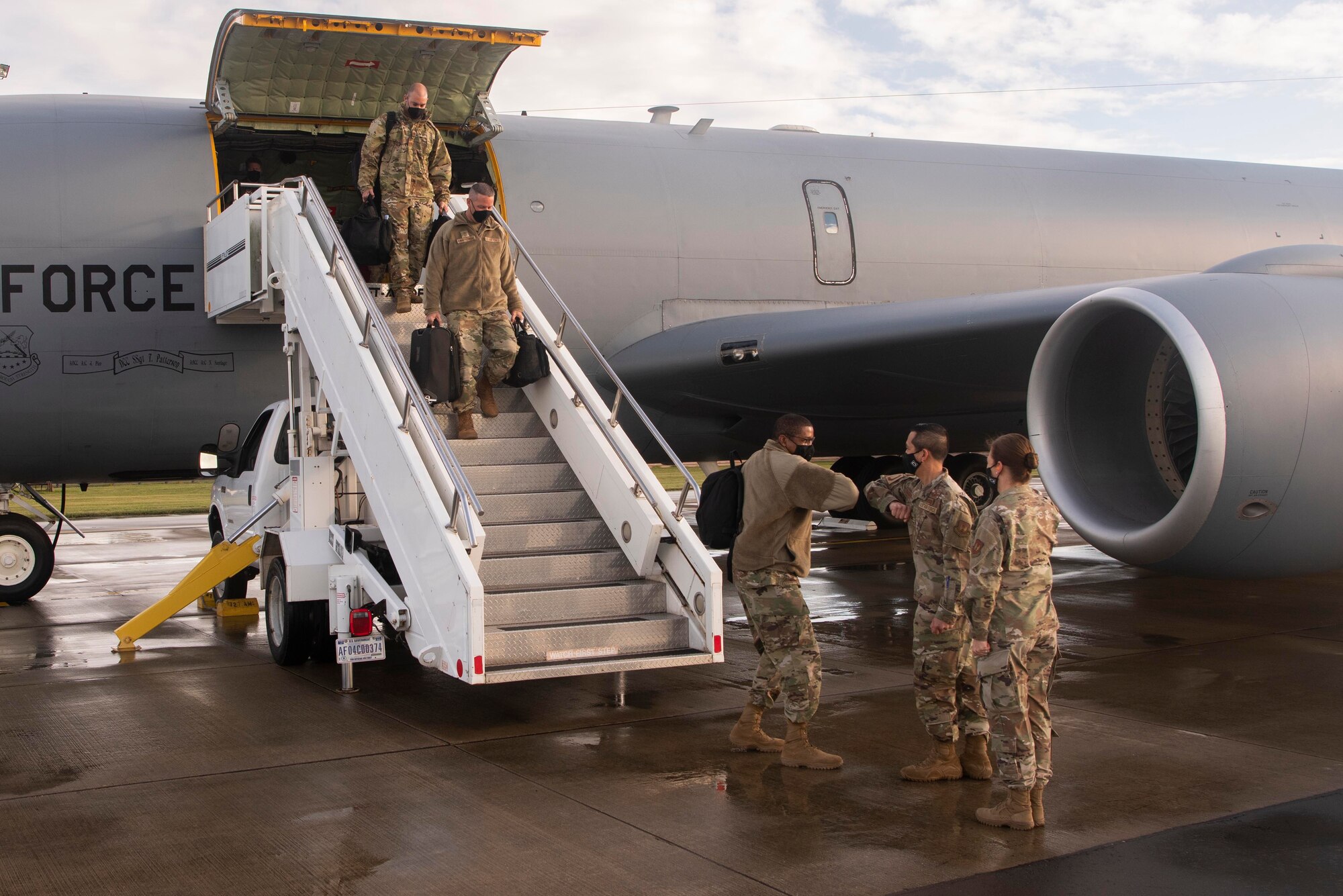 The 100th Air Refueling Wing leadership greet the Third Air Force command team as they deplane a KC-135 Stratotanker aircraft at Royal Air Force Mildenhall, England, Sept. 24, 2020. The Third Air Force command team showed their appreciation for Airmen across the installation during their visit to U.S. Air Forces in Europe and Air Forces Africa’s only air refueling wing. (U.S. Air Force photo by Airman 1st Class Joseph Barron)