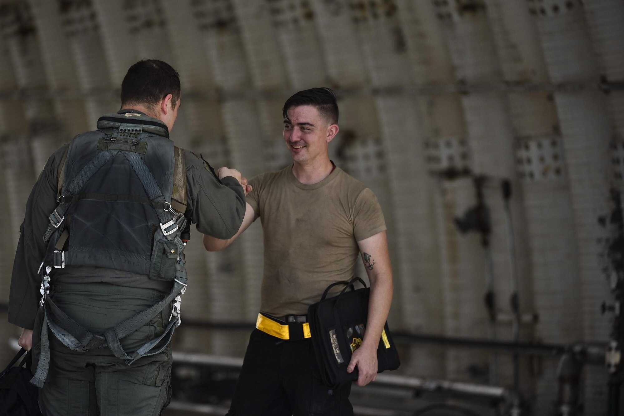 Maj. Houston “Meat” Pye, 8th Fighter Wing chief of safety and 80th Fighter Squadron pilot, greets Senior Airman Christopher Ryan-Shulls, 80th Aircraft Maintenance Unit crew chief, before his flight at Kunsan Air Base, Republic of Korea, Aug. 31, 2020.