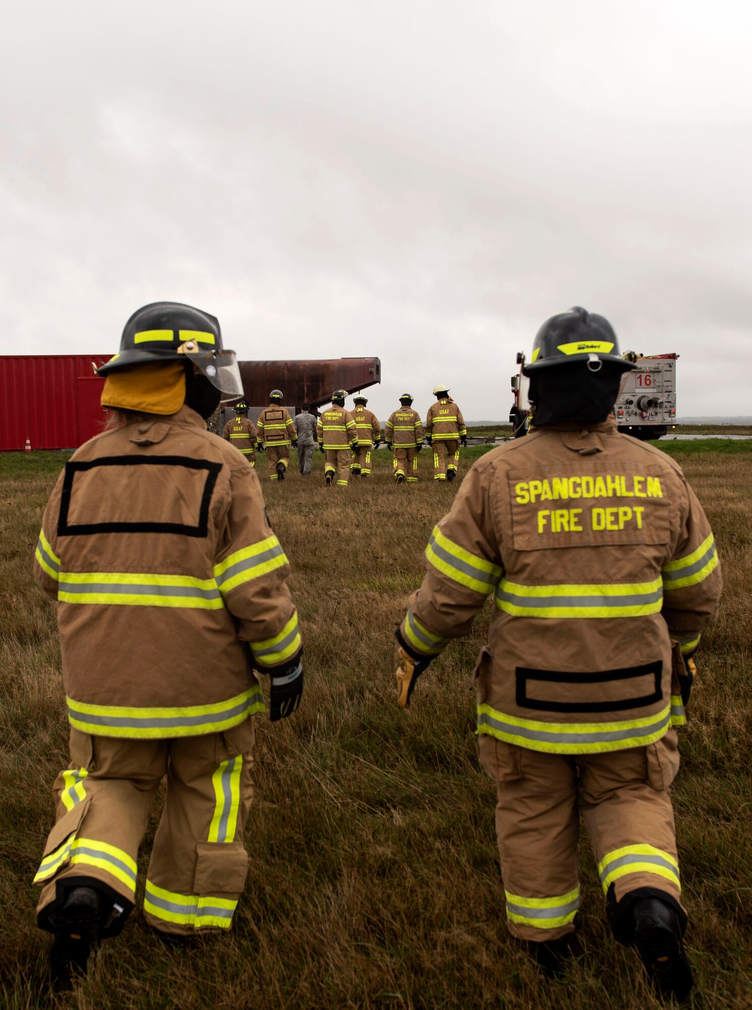 52nd Fighter Wing leadership participate in a demonstration by the Spangdahlem Fire Department, Oct. 5, 2020, at Spangdahlem Air Base, Germany. The demonstration consisted of simulated house fires, how to handle vehicle extrications, and a display of the fire department’s new fire truck and its capabilities. (U.S. Air Force photo by Senior Airman Melody W. Howley)