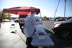 An Indiana National Guard medic preps a COVID testing station in Indianapolis Oct. 5, 2020. Medical teams deployed to 15 testing locations throughout Indiana to support Indiana State Department of Health and Fairbanks School of Public Health in an ongoing study to better understand COVID-19.