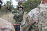 Kosovo Security Force Sgt. 1st Class Besart Berisha, an explosive ordnance disposal instructor, shows a detonator to U.S. EOD troops from Kosovo Force Regional Command-East on Harilaq Demolition Range outside Pristina, Kosovo, Oct. 2, 2020. KSF EOD conducted a certification for KSF EOD cadets and led a joint demolition.