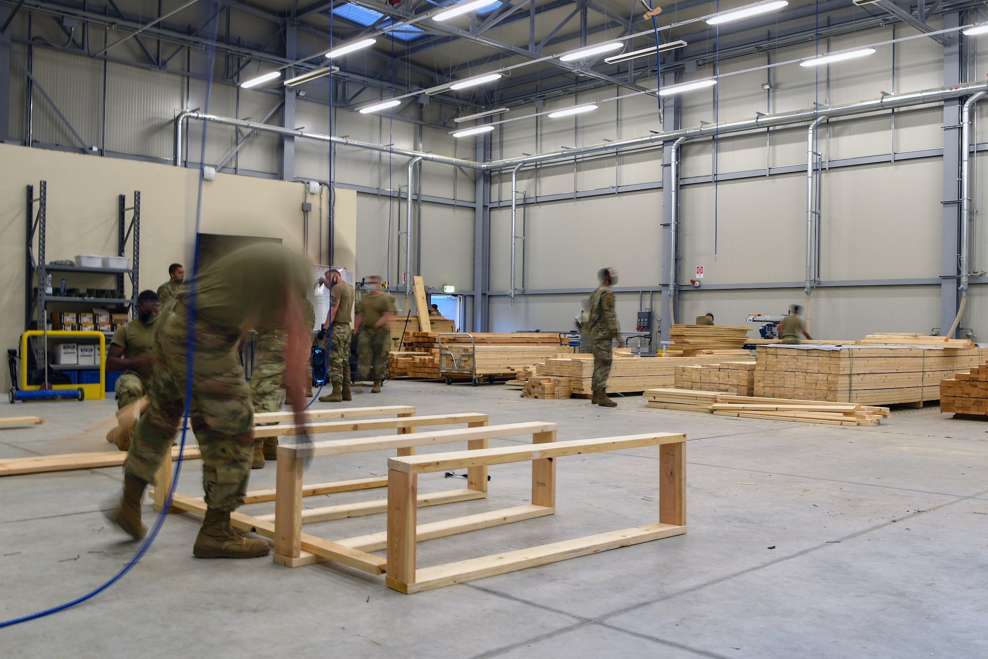Airmen with the 731st Munitions Squadron build wood bracings for an exercise at Camp Darby, Italy, Oct. 7, 2020. Waking Giant is a three-week, quarterly exercise with the 731st MUNS in which the squadron simulates a contingency environment. (U.S. Air Force photo by Airman 1st Class Thomas S. Keisler IV)