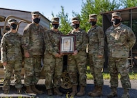 Photo of a group of Airmen standing in a line