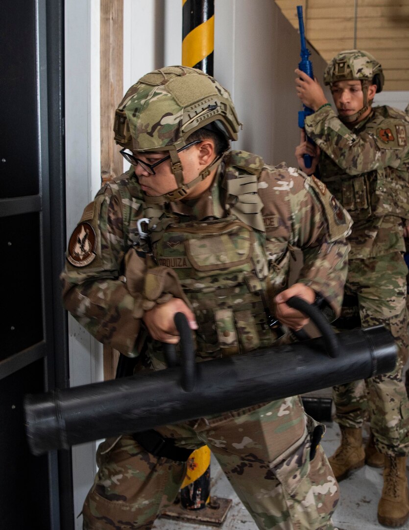Airman Alex Orquiza (front) and Senior Airman Craig Smith, both 71st Security Forces Squadron personnel, wear the next generation of ballistic helmets during a door breaching exercise at Vance Air Force Base, Oklahoma, Sept. 15.