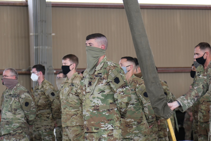 U.S. Soldiers with 1st Battalion, 137th Aviation Regiment, 28th Expeditionary Combat Aviation Brigade stand in formation during a transfer of authority ceremony.