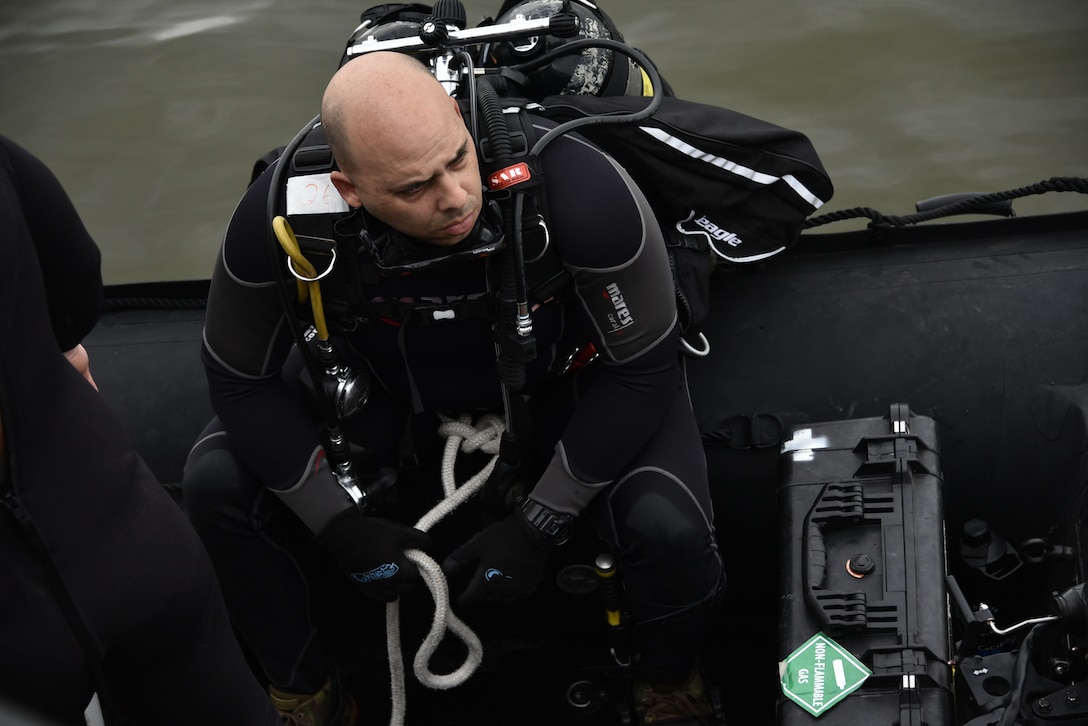 U.S. Army diver prepares to conduct a security dive at Port Arthur, Texas.