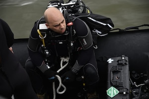 U.S. Army diver prepares to conduct a security dive at Port Arthur, Texas.