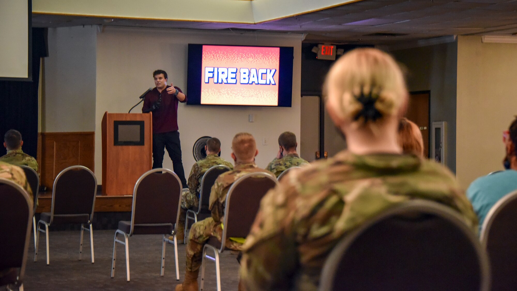 Jared Estes speaks to permanent party Airmen at the Sheppard Club