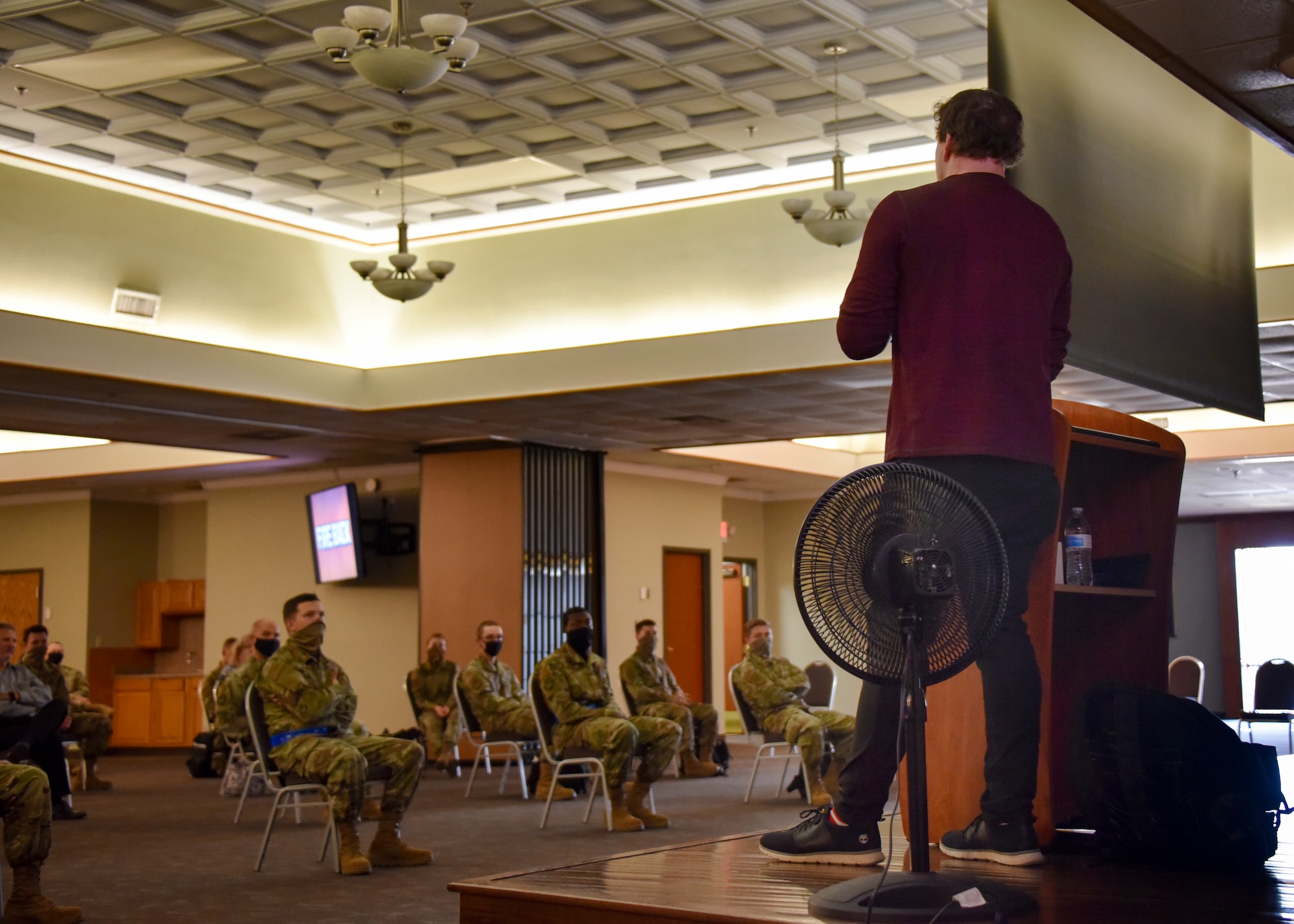 Jared Estes speaks to permanent party Airmen at the Sheppard Club