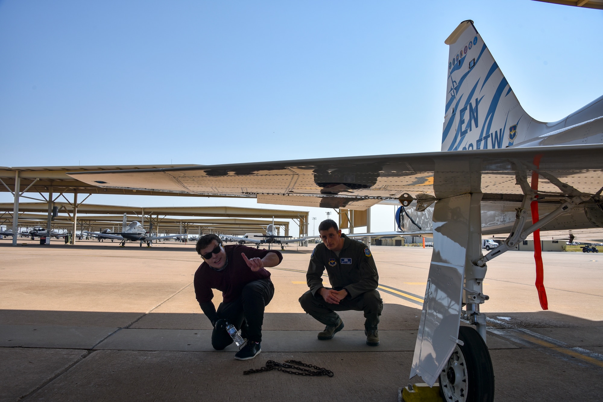 Jared Estes takes a look at a T-38C Talon with 2nd Lt. Michael Brown