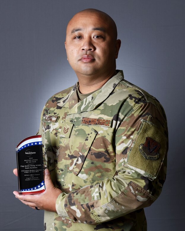 Photo of Airman holding award