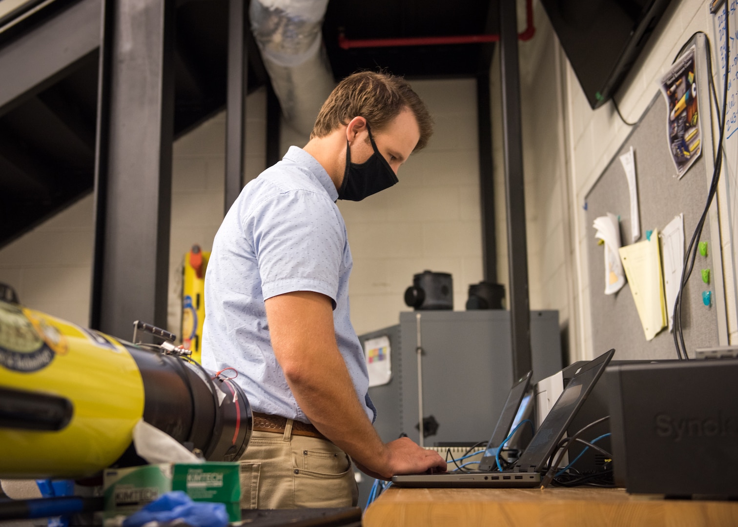 Adam Coffman, NSWC PCD computer engineer, performs cyber reconnaissance of the unmanned system. U.S. Navy photo by Anthony Powers