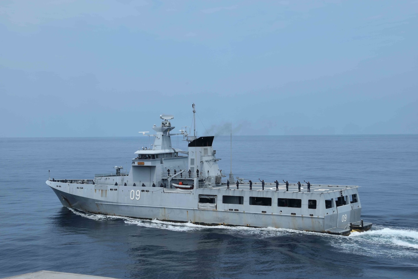 SOUTH CHINA SEA (Oct. 6, 2020) The Royal Brunei Navy offshore patrol vessel KDB Daruttaqwa (DTQ 09), sails alongside the Spearhead-class expeditionary fast transport USNS Millinocket (T-EPF 3) during a ceremonial departure at the conclusion of the sea phase of Cooperation Afloat Readiness and Training (CARAT) Brunei. This year marks the 26th iteration of CARAT, a multinational exercise designed to enhance U.S. and partner navies' abilities to operate together in response to traditional and non-traditional maritime security challenges in the Indo-Pacific region. (U.S. Navy photo by Lt. Alexander Laabs)