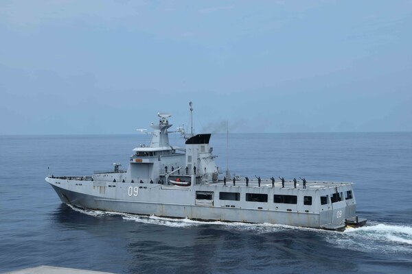 SOUTH CHINA SEA (Oct. 6, 2020) The Royal Brunei Navy offshore patrol vessel KDB Daruttaqwa (DTQ 09), sails alongside the Spearhead-class expeditionary fast transport USNS Millinocket (T-EPF 3) during a ceremonial departure at the conclusion of the sea phase of Cooperation Afloat Readiness and Training (CARAT) Brunei. This year marks the 26th iteration of CARAT, a multinational exercise designed to enhance U.S. and partner navies' abilities to operate together in response to traditional and non-traditional maritime security challenges in the Indo-Pacific region. (U.S. Navy photo by Lt. Alexander Laabs)