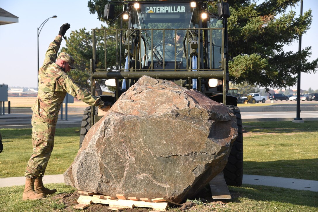 loading memorial stone on forklift