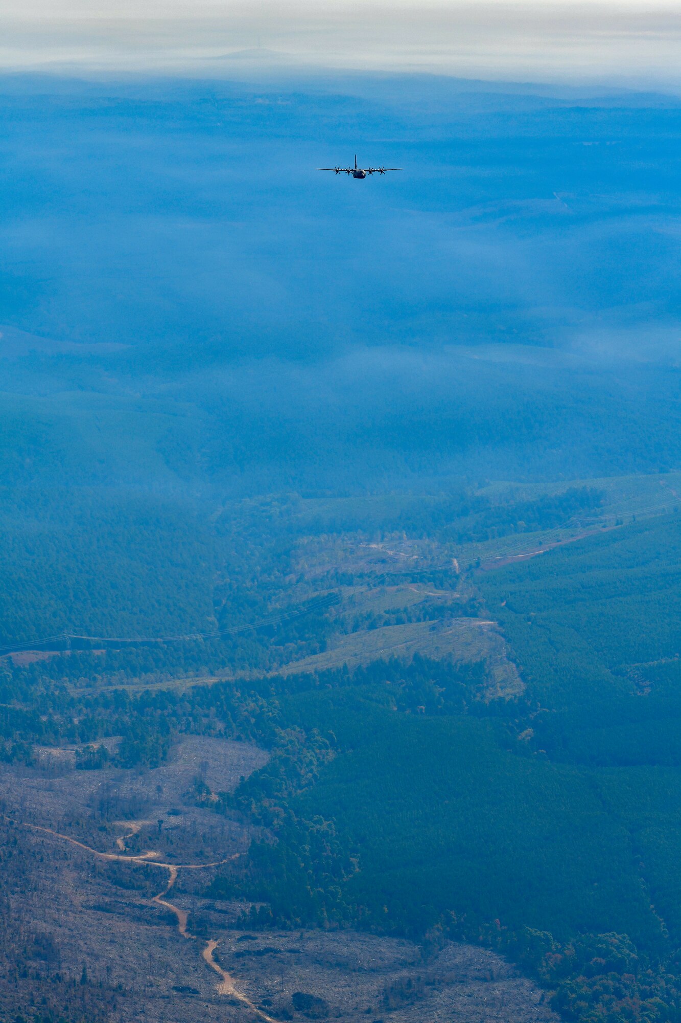Plane flying over a field