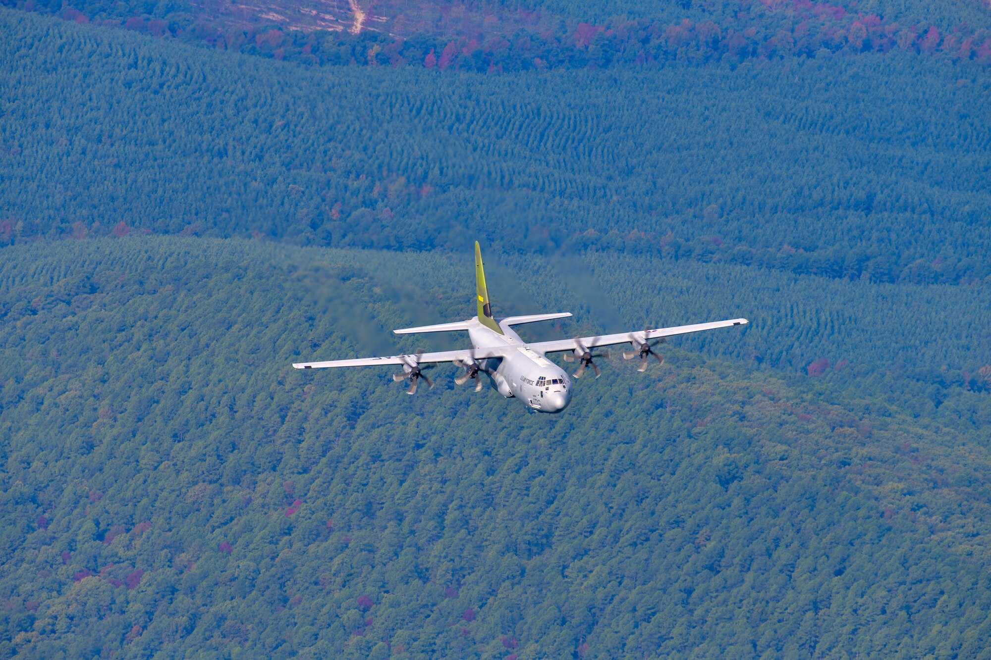 Plane flying over field