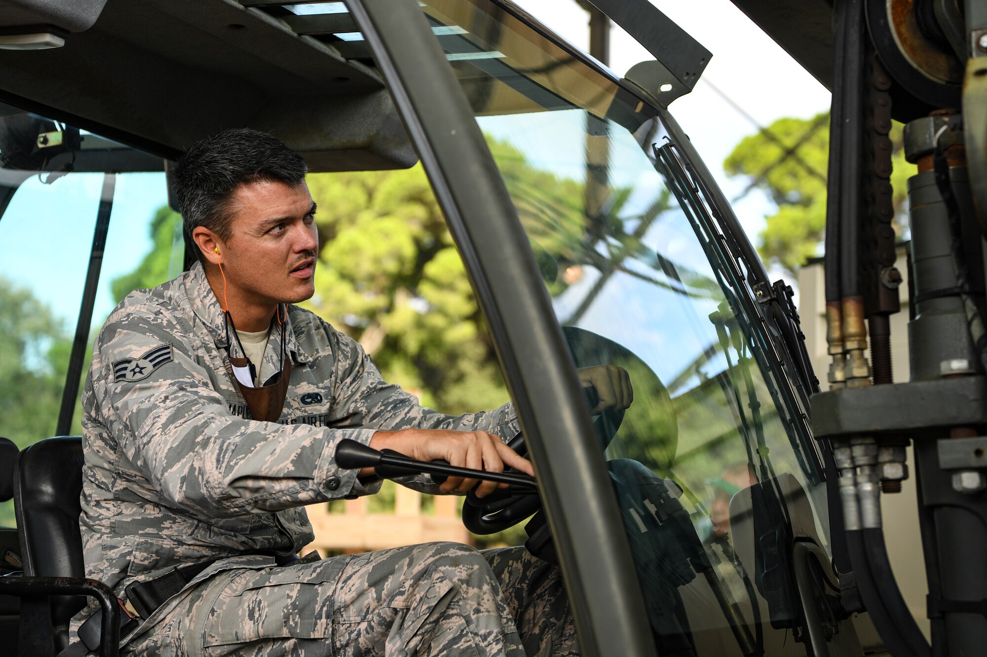An Airman with the 731st Munitions Squadron loads munitions into an intermodal shipping container during an exercise at Camp Darby, Italy, Oct. 7, 2020. Waking Giant is a quarterly exercise at the 731st MUNS. (U.S. Air Force photo by Airman 1st Class Thomas S. Keisler IV)
