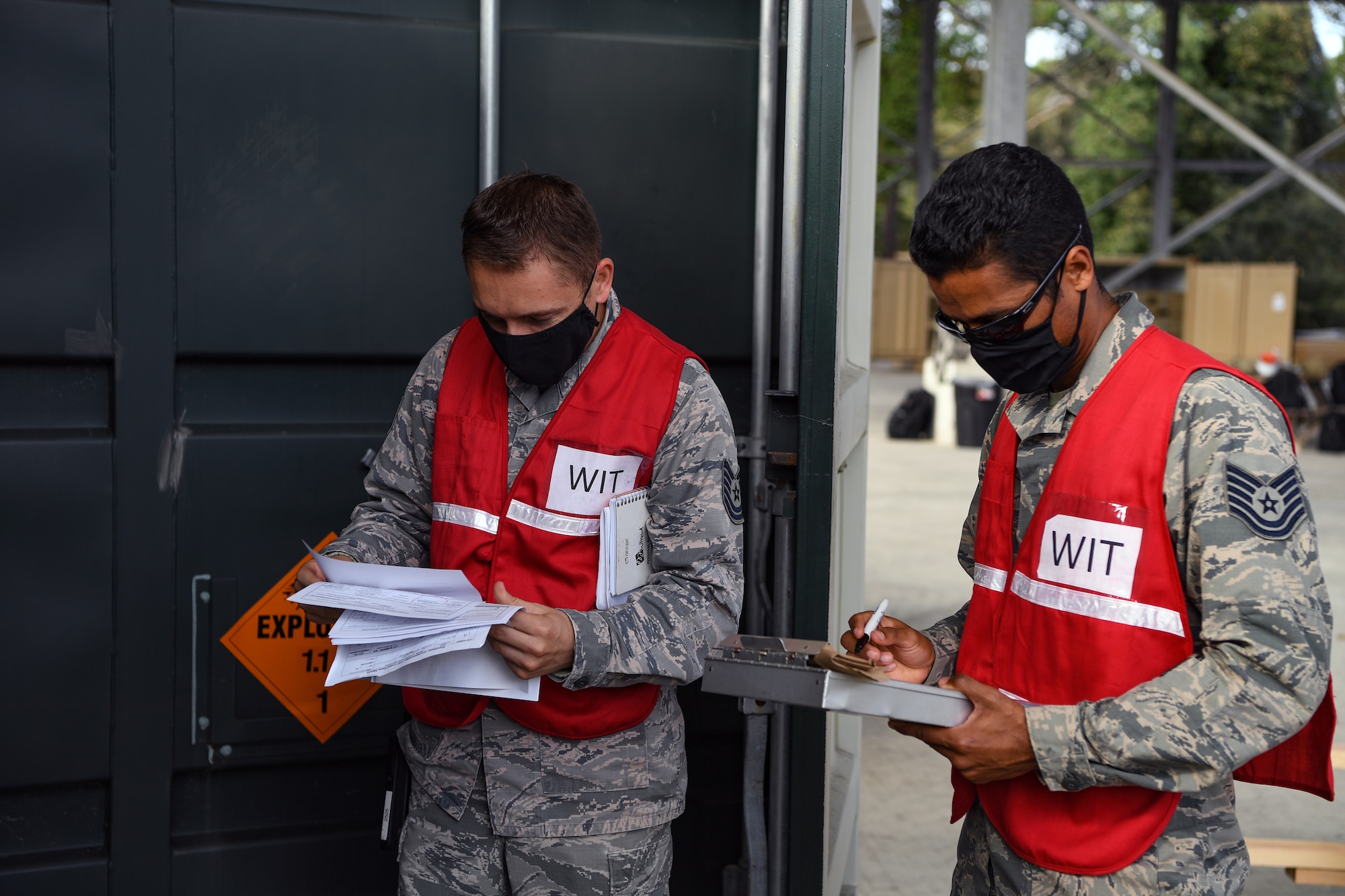 Airmen with the 31st Fighter Wing perform an inspection on an intermodal shipping container during Waking Giant at Camp Darby, Italy, Oct. 7, 2020. Quality Assurance and the Wing Inspection Team ensured all safety guidance and rules were being followed. (U.S. Air Force photo by Airman 1st Class Thomas S. Keisler IV)