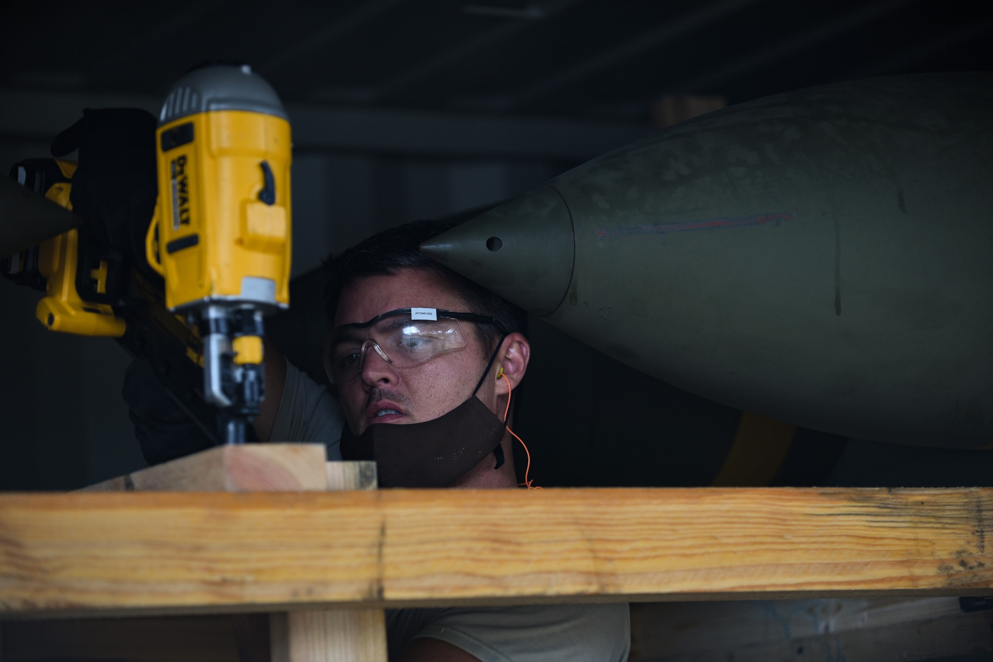 An Airman with the 731st Munitions Squadron secures a bracing inside an intermodal shipping container during Waking Giant at Camp Darby, Italy, Oct. 7, 2020. The 731st MUNS endeavors to be U.S. Air Forces in Europe’s premier munitions hub, capable of receiving, maintaining and shipping munitions by rail, sea, or road to any destination globally. (U.S. Air Force photo by Airman 1st Class Thomas S. Keisler IV)