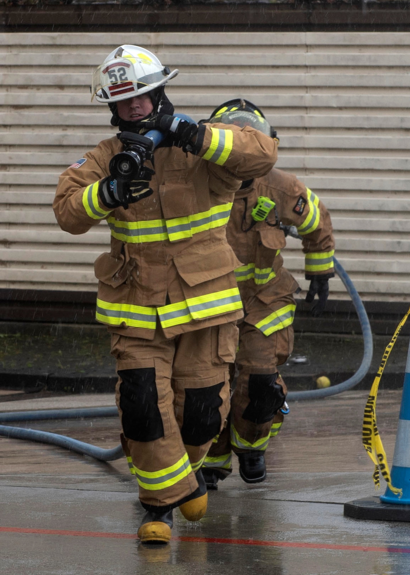 U.S. Air Force Col. David Epperson, 52nd Fighter Wing commander, participates in an obstacle course hosted by the 52nd Civil Engineer Squadron Fire and Emergency Services firefighters, Oct. 5, 2020, at Spangdahlem Air Base, Germany. The obstacle course concluded the Fire Prevention Week activities and consisted of exercises and drills similar to what 52nd FES Airmen go through to maintain mission readiness. (U.S. Air Force photo by Senior Airman Melody W. Howley)