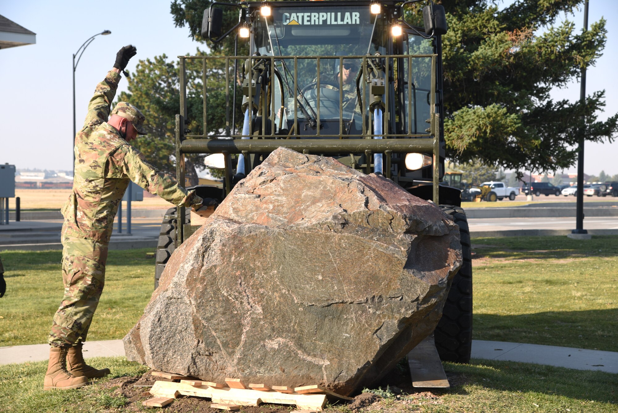 loading memorial stone on forklift